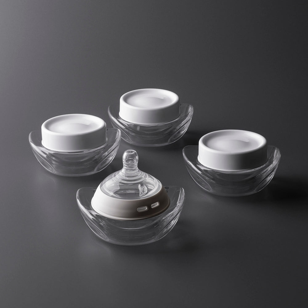 Three collector bottles with lids and one collector bottle with nipple attached.
