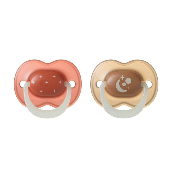 NightGlow pacifiers on a white background.