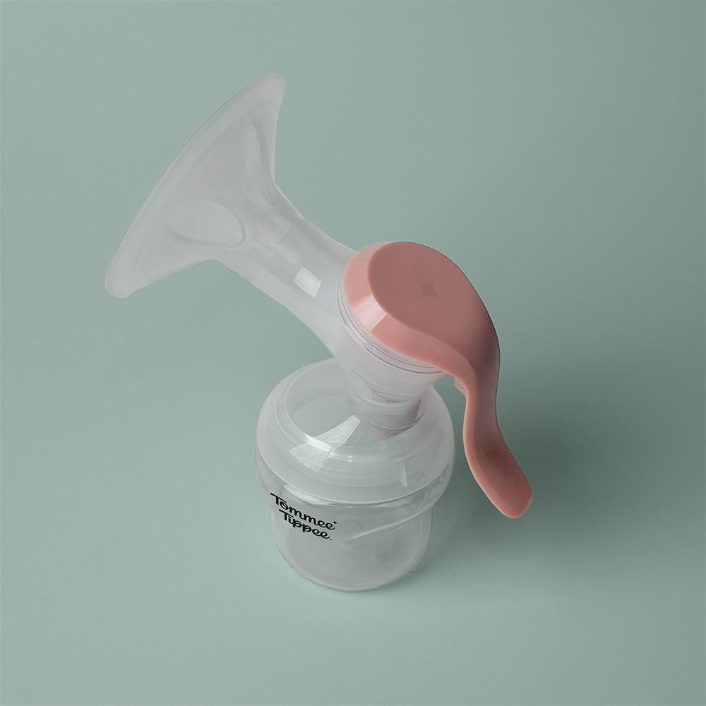 Tommee Tippee Manual Breast Pump on blue background