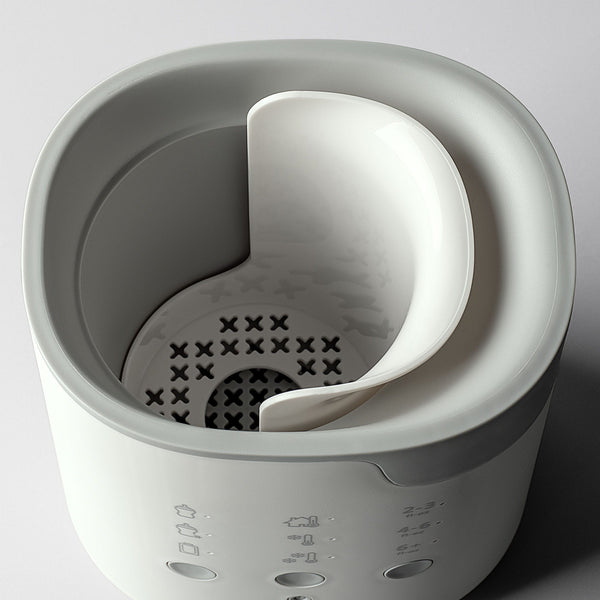 Ariel shot showing the inside of a Multiwarm bottle warmer against a grey background