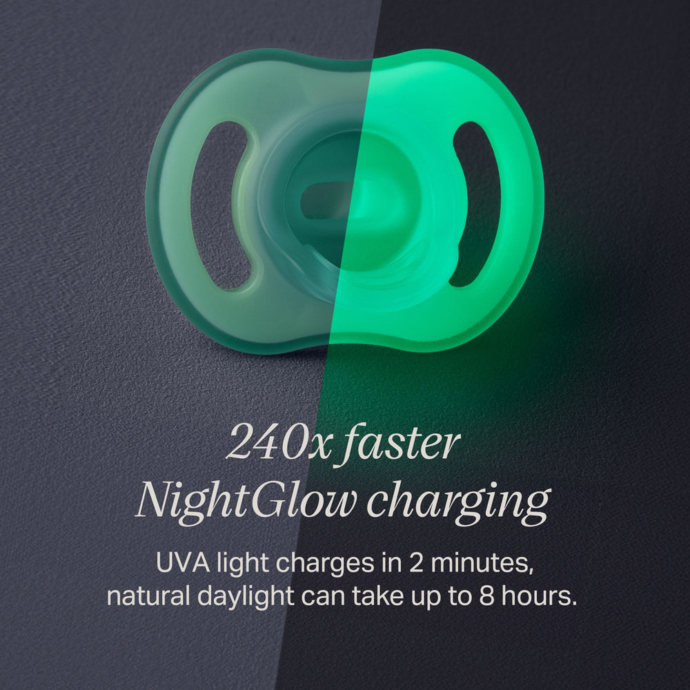 Ultra-light NightGlow pacifier in two halves to show charge with the NightGlow Pod versus daylight.