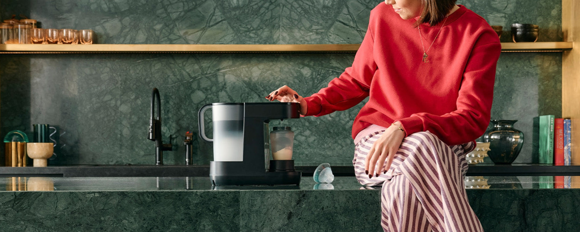 Mum sat on kitchen bench using Perfect Prep®