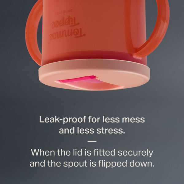 Tommee Tippee First Cup upside down against a grey background with text stating 