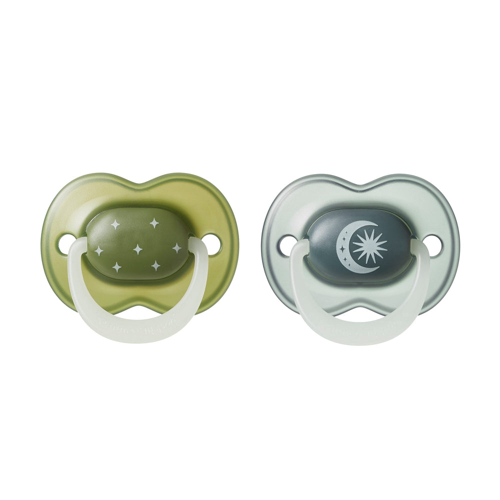 NightGlow pacifiers on a white background.