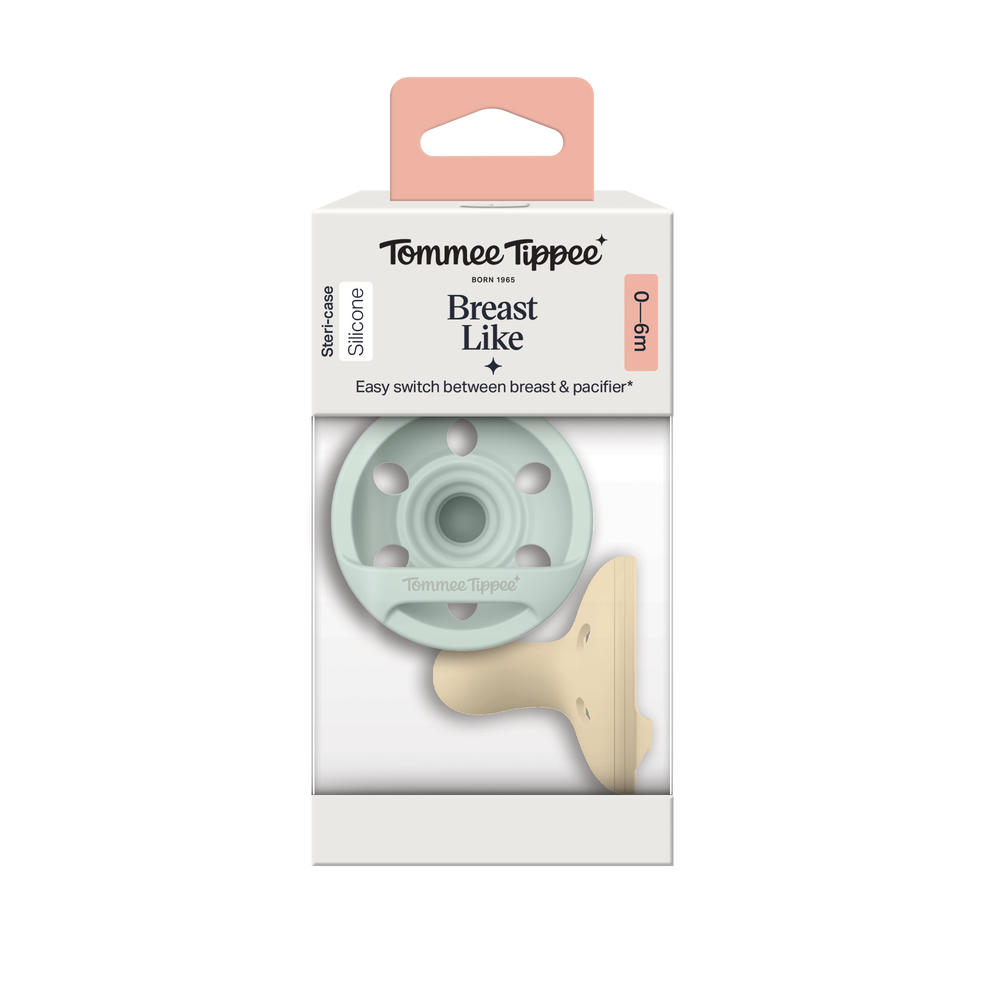 Breast-like pacifiers inside a packaging box on a white background.