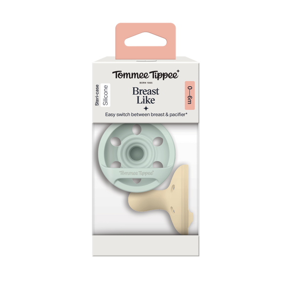Breast-like pacifiers inside a packaging box on a white background.
