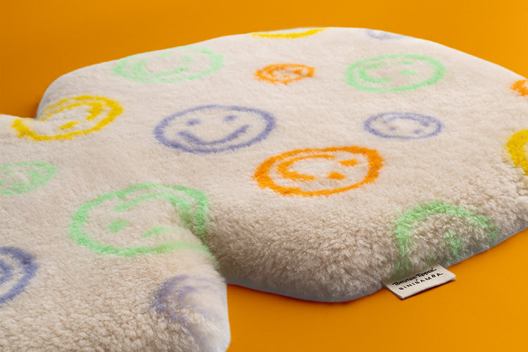 Tommee Tippee x Binibamba Snuggler on orange background