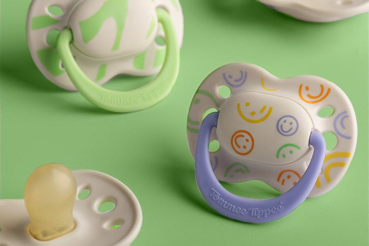 Tommee Tippee x Binibamba Soothers on green background