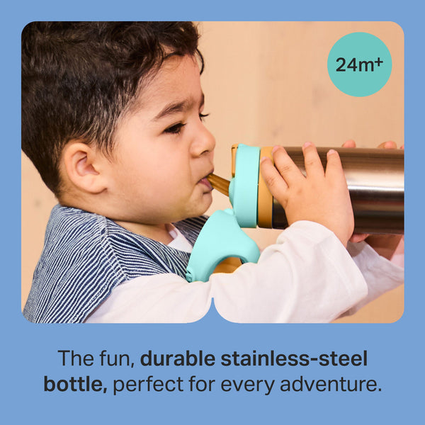 Toddler drinking from a Tommee Tippee On-the-Go Stainless Steel Insulated Bottle with text stating 