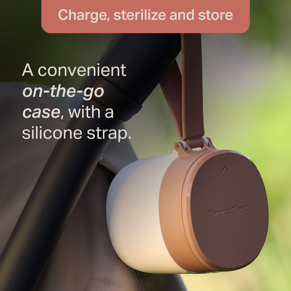 NightGlow Pod silicone strap attached to a stroller with text about on-the-go storage and sterilization.