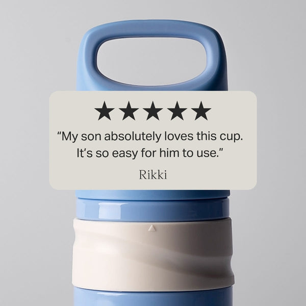Blue and red on-the-go straw cups against a grey background with text overlay of a customer review