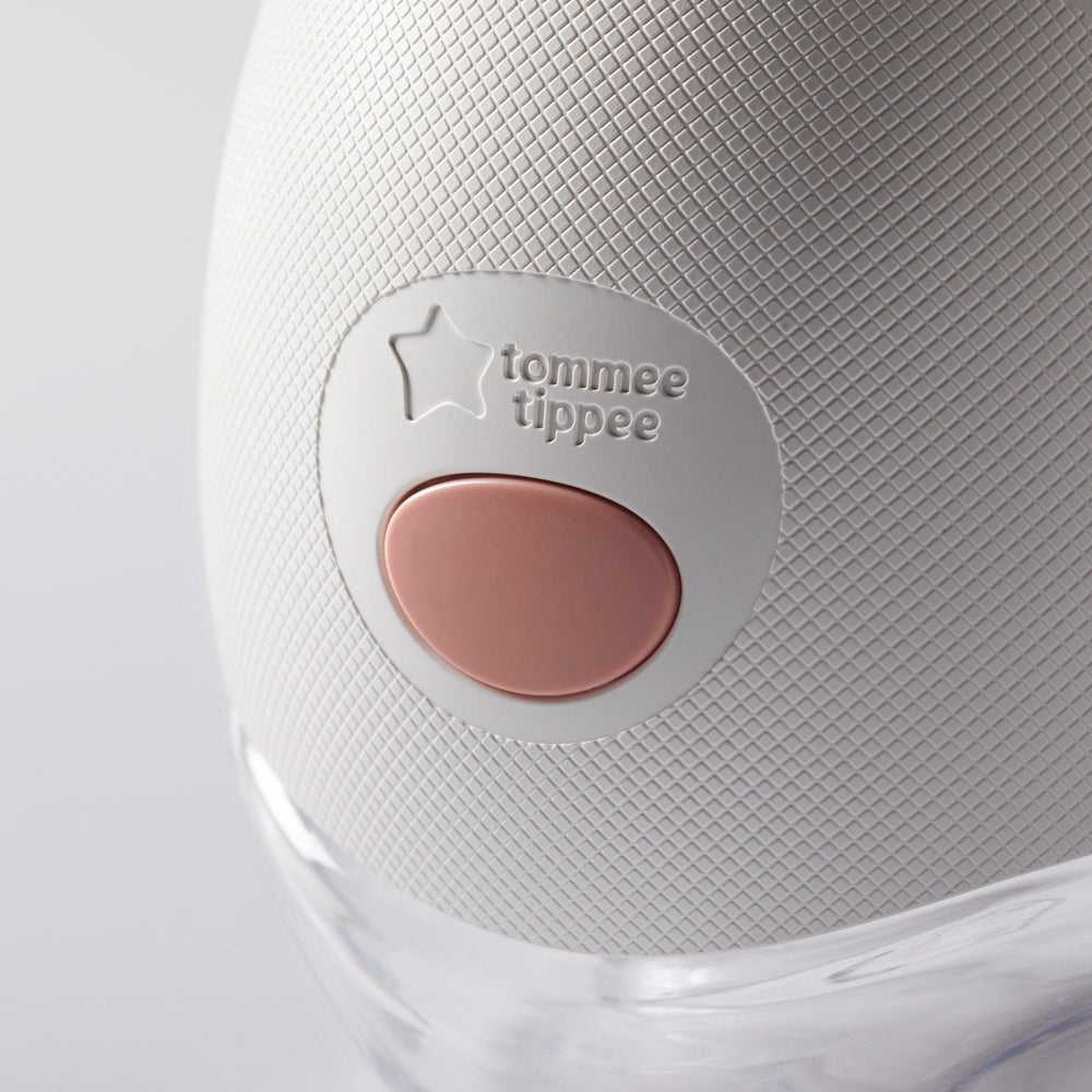 Close-up of a collector bottle connected to a wearable breast pump.