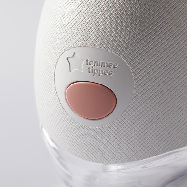 Close-up of a collector bottle connected to a wearable breast pump.