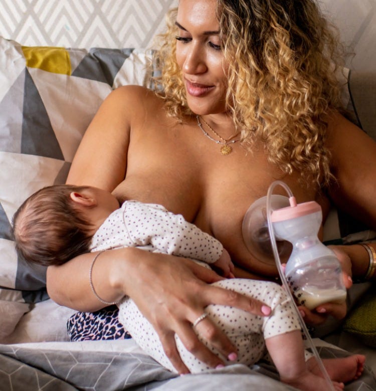 How to Clear and Prevent Blocked Milk Ducts Mum sitting in bed using an electric breast pump while breastfeeding her baby