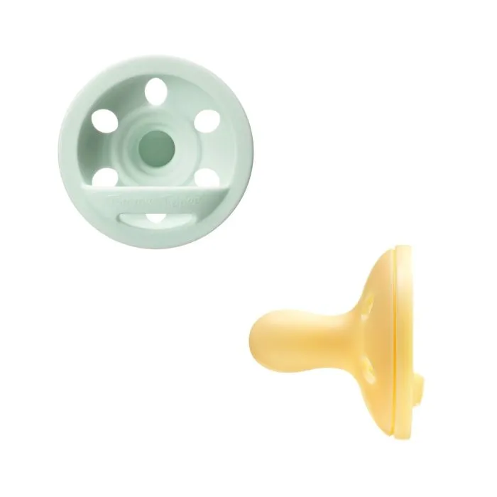 Breast-like soothers on a white background.