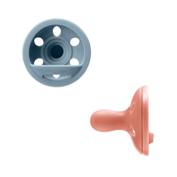 Breast-like soothers on a white background.