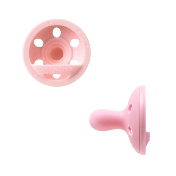 Breast-like soothers on a white background.