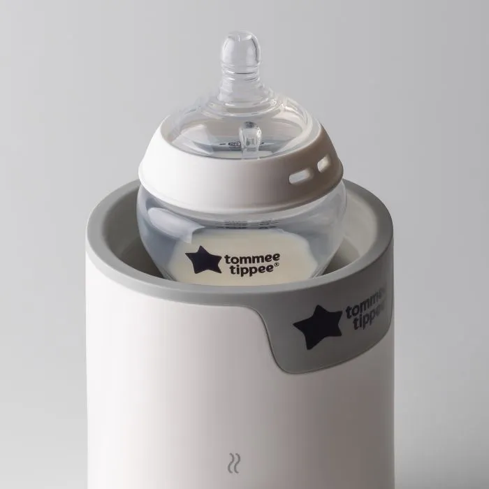 Natural Start bottle in a bottle warmer against a light grey background.