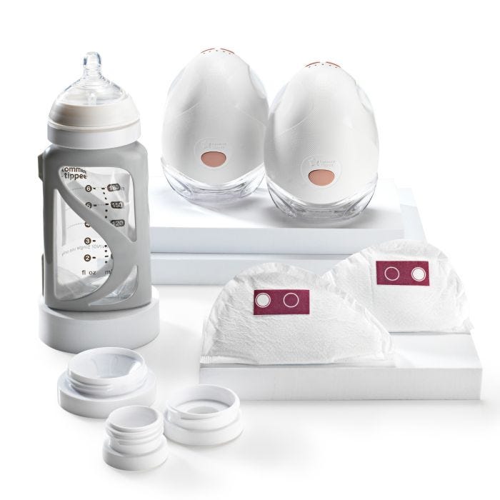 Product imagery of contents of wearable breast pump bundle on a white background