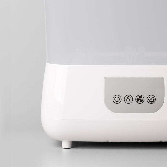 Close up of the buttons on the front of a SteriDryer against a grey background