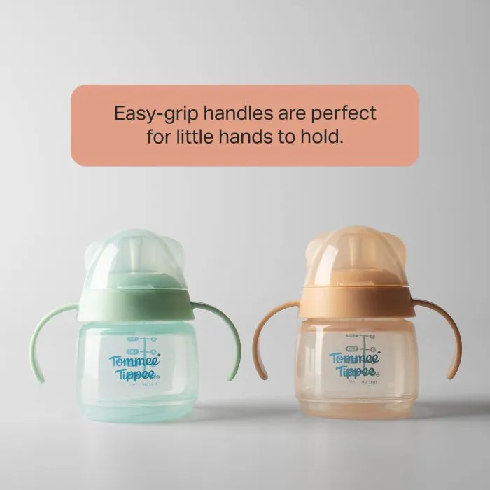Green and orange transition spout cups against a grey background with text overlay of product messaging