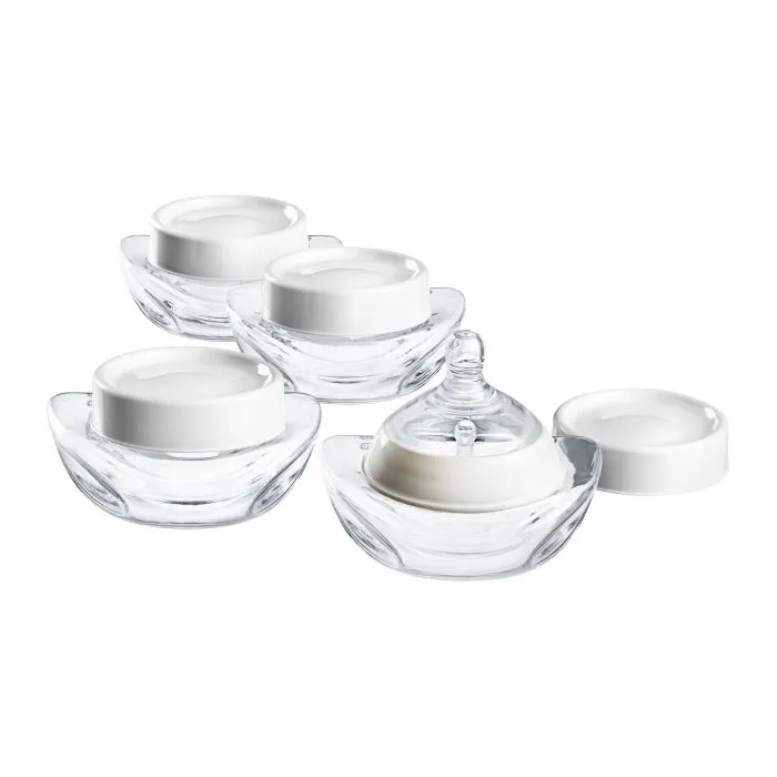 Four milk collector bottles against a white background