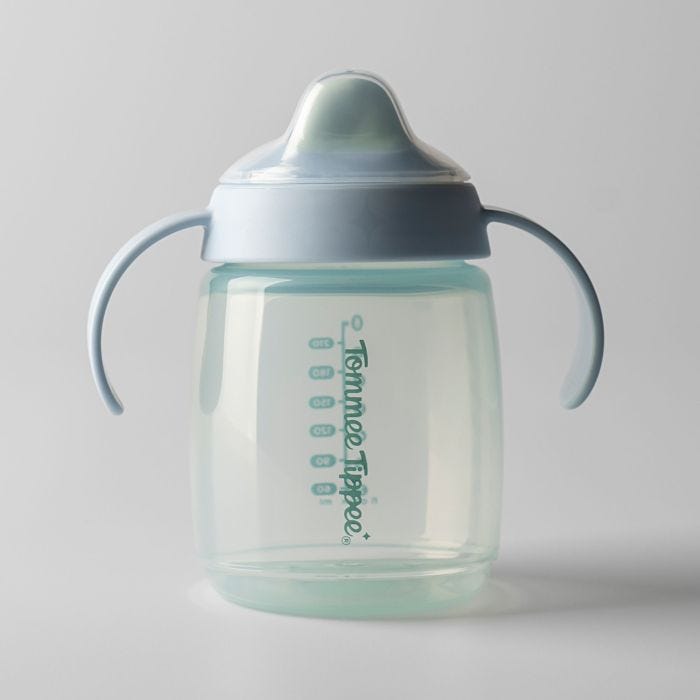 Blue Starter Spout cup against a grey background