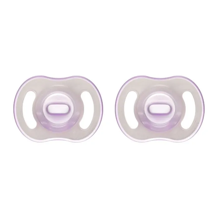 Ultra-light Night Glow pacifiers on a white background.