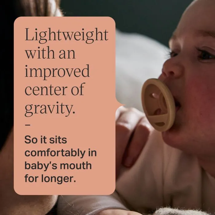 Baby with a breast-like pacifier with text about the lightweight design.
