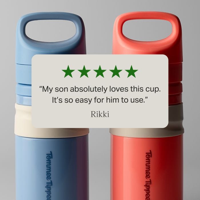 Blue and red on-the-go straw cups against a grey background with text overlay of a customer review