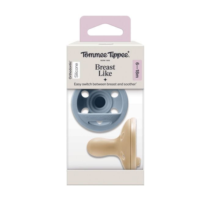 Breast-like soothers in a packaging box on a white background.