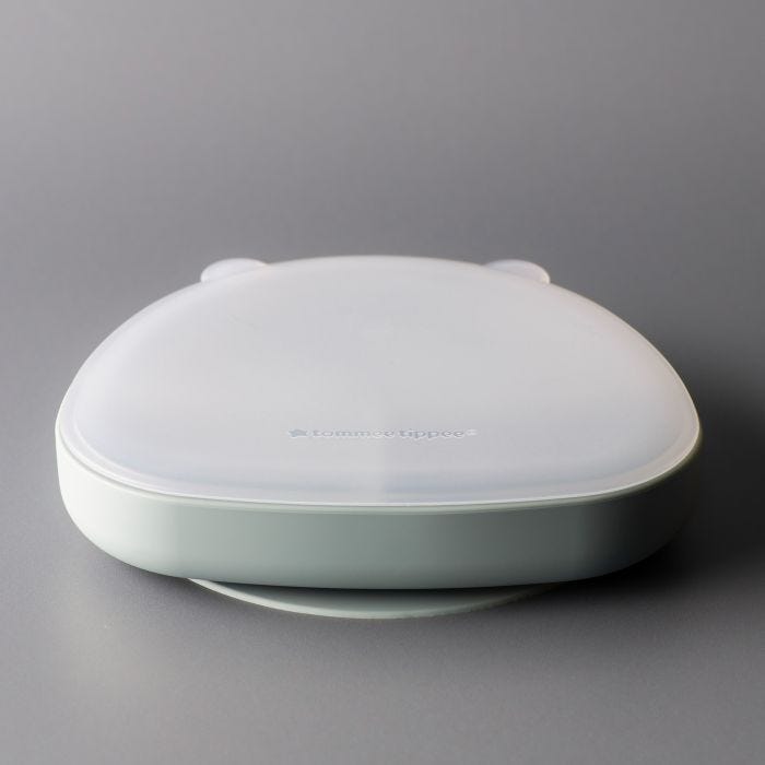 Silicone section plate with lid on a grey background