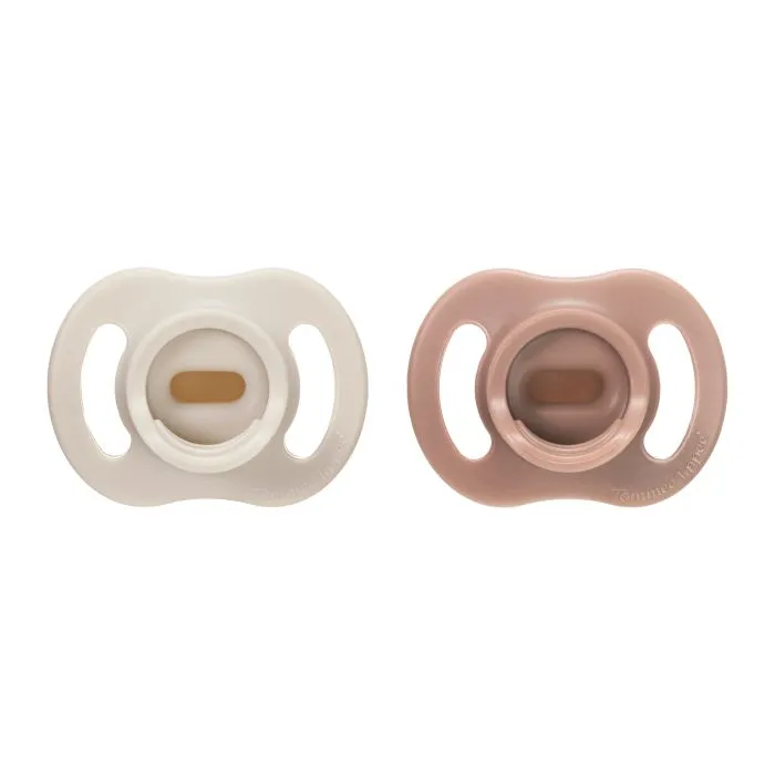 Ultra-light StayPut pacifiers on a white background.