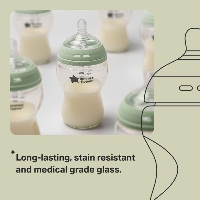 Glass baby bottles containing milk with text about resistant glass.