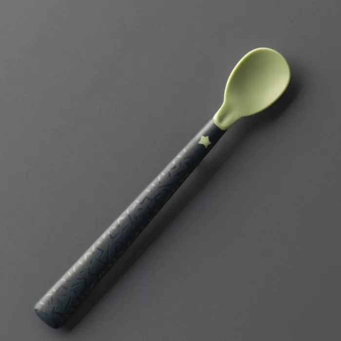 Softee weaning spoon on a grey background