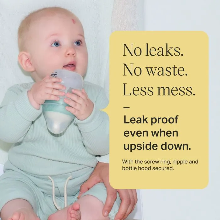 Baby holding an Advanced Anti-colic bottle upside down alongside text overlay of product messaging