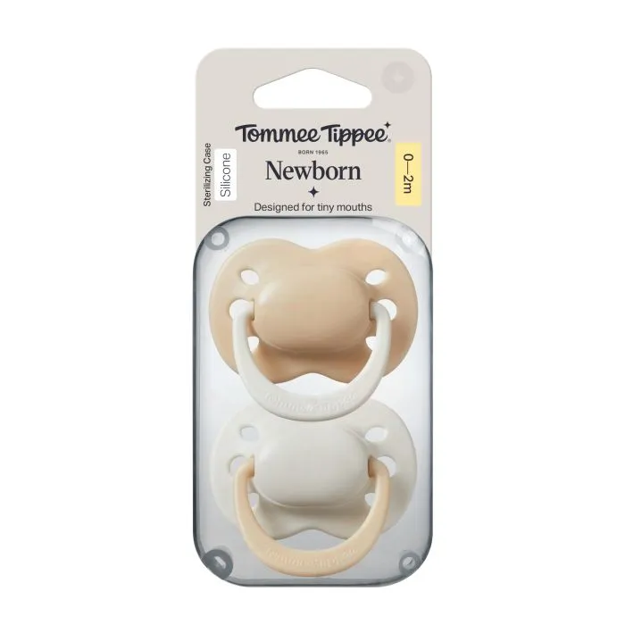 Newborn pacifiers in packaging on a white background.