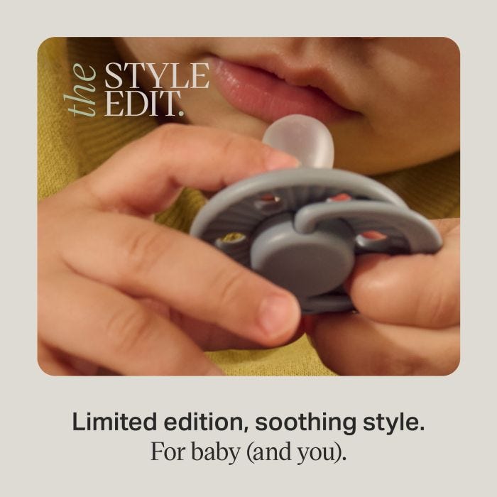 Close-up of a baby holding a limited edition soother near their mouth.