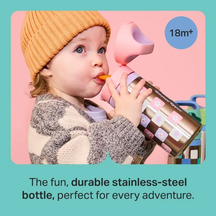 Toddler drinking from a pink Tommee Tippee On-the-Go Stainless Steel Insulated Bottle with text stating "The fun