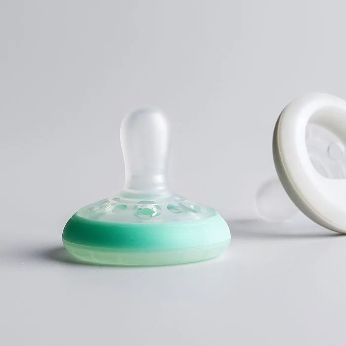 Pacifiers on a grey background