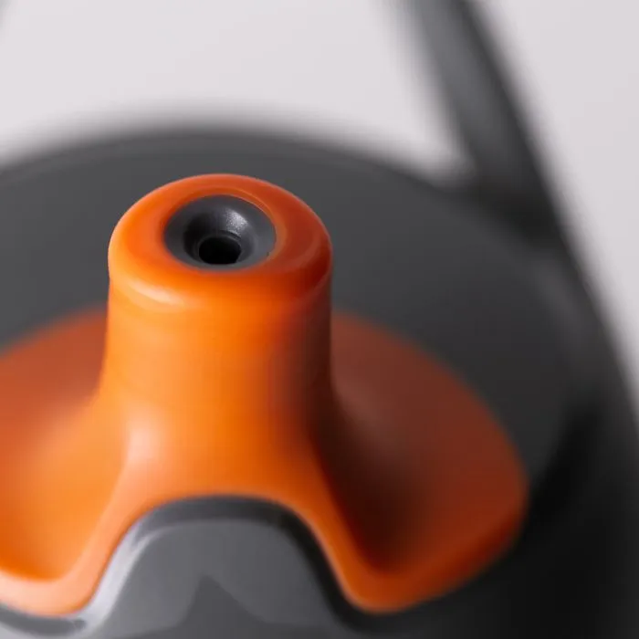 Close up of the insulated sportee bottle against a grey background