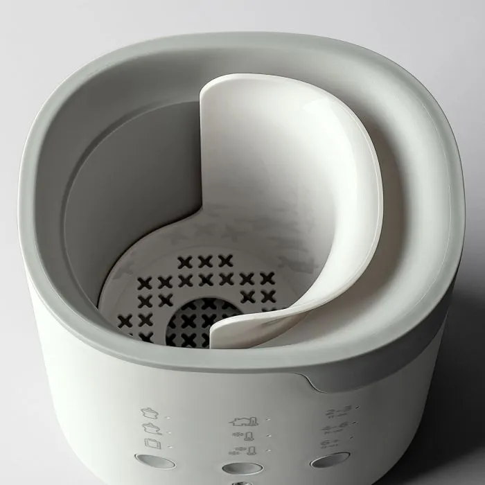 Ariel shot showing the inside of a Multiwarm bottle warmer against a grey background
