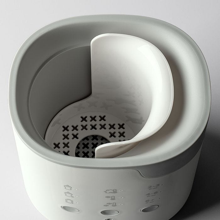 Ariel shot showing the inside of a Multiwarm bottle warmer against a grey background