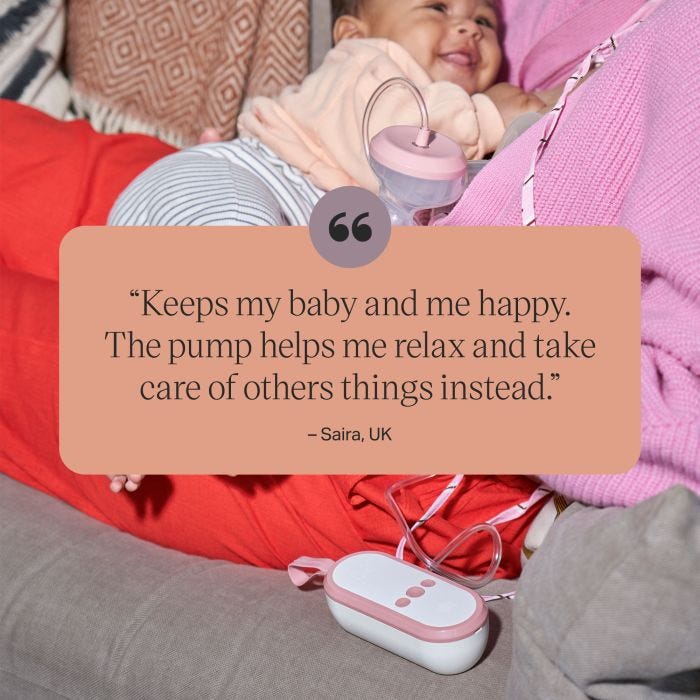 Parent expressing while holding baby behind a positive customer review.