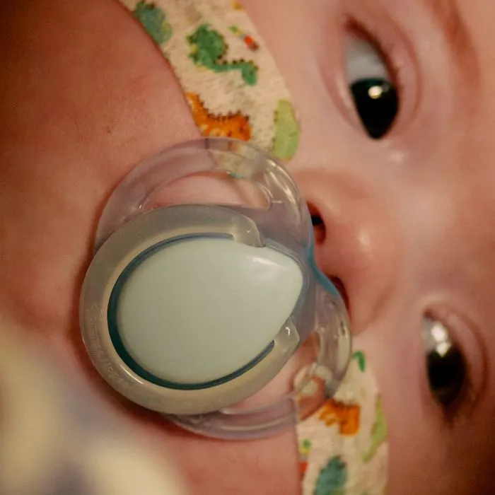 Close up of soother in baby’s mouth