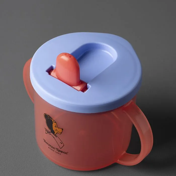 Close up image of First Cup with the spout up against a dark grey background