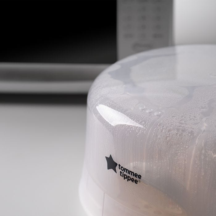 Close up of a microwave sterilizer on a kitchen worktop with a microwave in the background