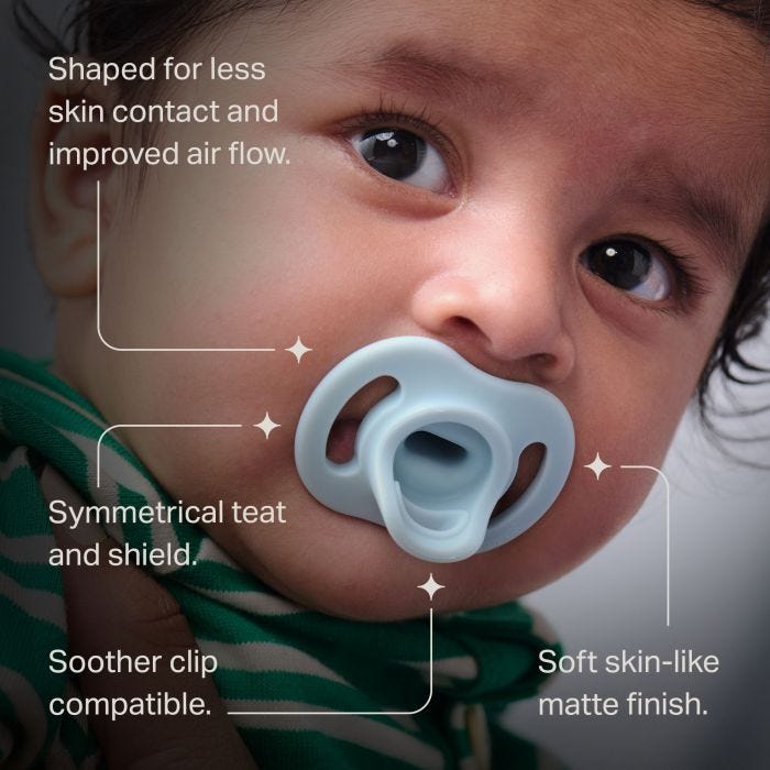 Feature text in front of a baby with an Ultra-light StayPut soother.