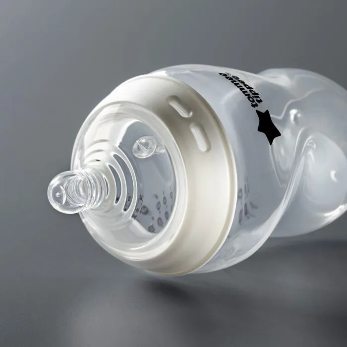 Natural Start bottle laying on its side on a dark grey background.