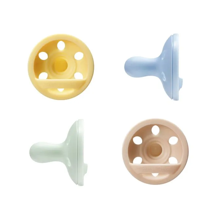 Breast-like soothers on a white background.